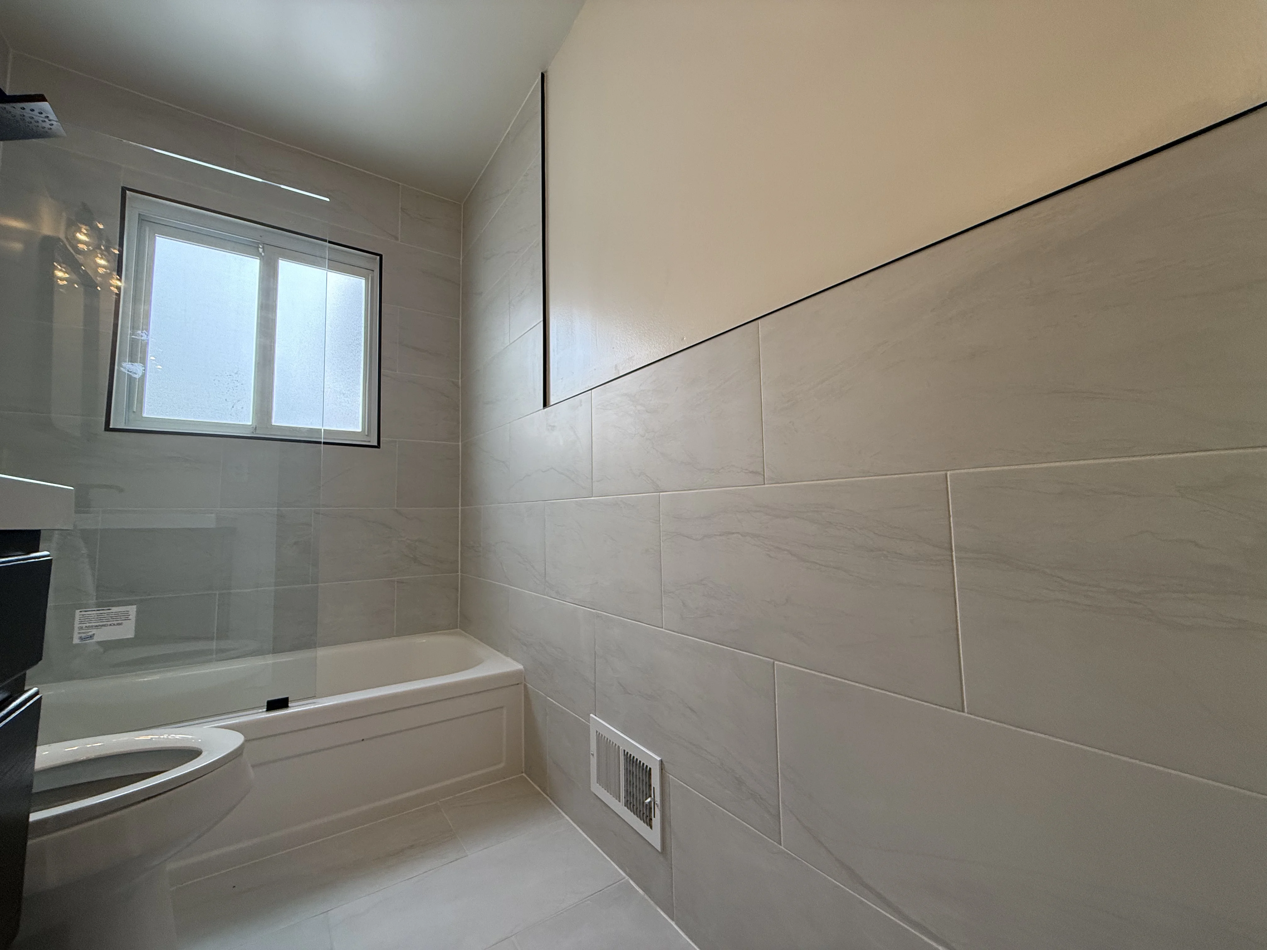 Laser-aligned tile installation in Genesee County