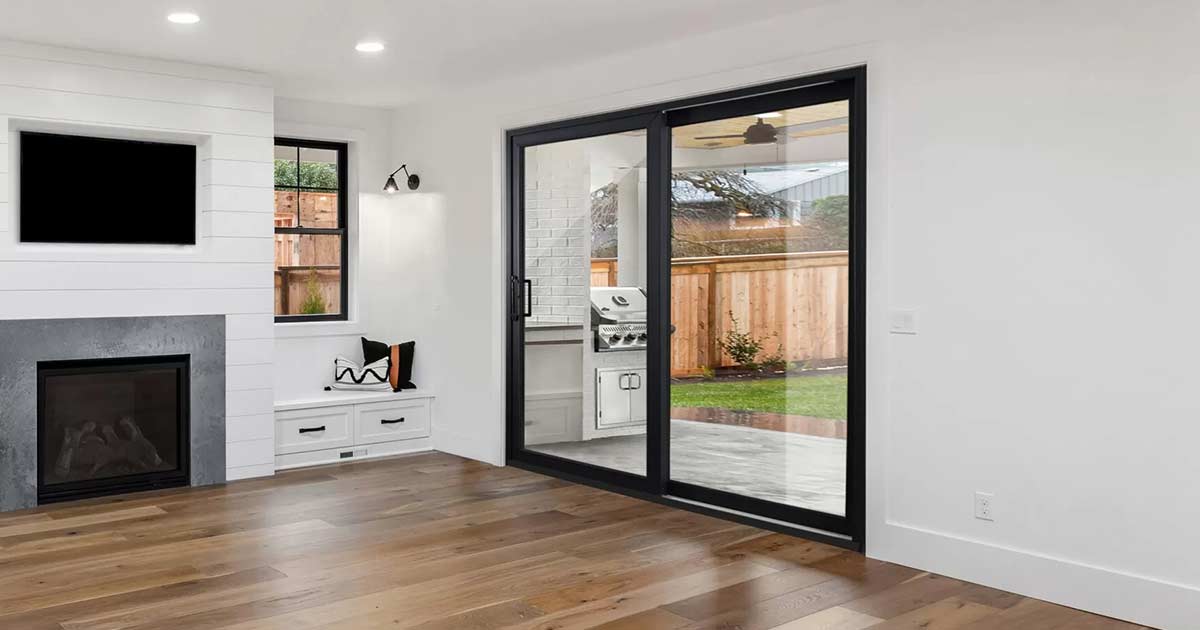 Modern sliding glass patio door connecting to deck